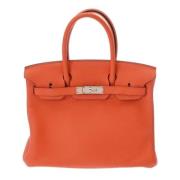 Pre-owned Leather handbags Hermès Vintage , Orange , Dames