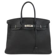 Pre-owned Leather handbags Hermès Vintage , Black , Dames