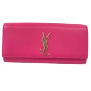 Pre-owned Leather clutches Yves Saint Laurent Vintage , Pink , Dames