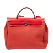 Pre-owned Canvas handbags Hermès Vintage , Red , Dames