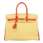 Pre-owned Leather handbags Hermès Vintage , Yellow , Dames