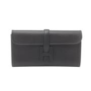 Pre-owned Leather clutches Hermès Vintage , Black , Dames