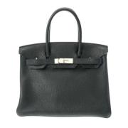 Pre-owned Leather handbags Hermès Vintage , Black , Dames