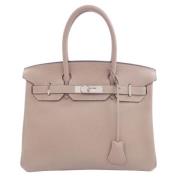 Pre-owned Leather handbags Hermès Vintage , Beige , Dames