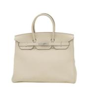 Pre-owned Leather handbags Hermès Vintage , Beige , Dames