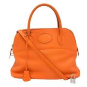 Pre-owned Leather handbags Hermès Vintage , Orange , Dames