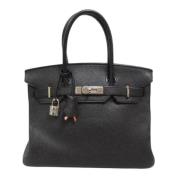 Pre-owned Leather handbags Hermès Vintage , Black , Dames