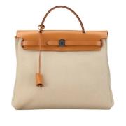 Pre-owned Canvas handbags Hermès Vintage , Beige , Dames