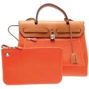 Pre-owned Leather handbags Hermès Vintage , Orange , Dames