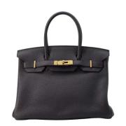 Pre-owned Leather handbags Hermès Vintage , Black , Dames