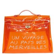 Pre-owned Vinyl handbags Hermès Vintage , Orange , Dames