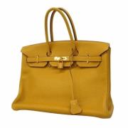 Pre-owned Leather handbags Hermès Vintage , Yellow , Dames