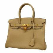 Pre-owned Leather handbags Hermès Vintage , Beige , Dames