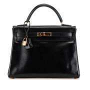 Pre-owned Leather handbags Hermès Vintage , Black , Dames