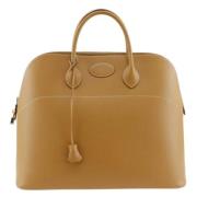 Pre-owned Leather handbags Hermès Vintage , Beige , Dames