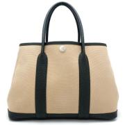 Pre-owned Canvas handbags Hermès Vintage , Beige , Dames