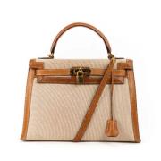 Pre-owned Canvas handbags Hermès Vintage , Beige , Dames