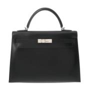 Pre-owned Leather handbags Hermès Vintage , Black , Dames