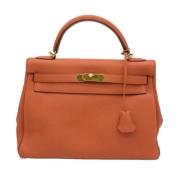 Pre-owned Leather handbags Hermès Vintage , Orange , Dames