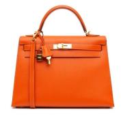 Pre-owned Leather handbags Hermès Vintage , Orange , Dames