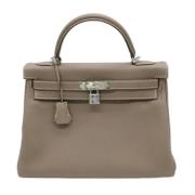 Pre-owned Leather handbags Hermès Vintage , Beige , Dames