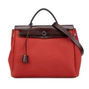 Pre-owned Canvas handbags Hermès Vintage , Red , Dames