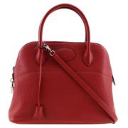 Pre-owned Leather handbags Hermès Vintage , Red , Dames