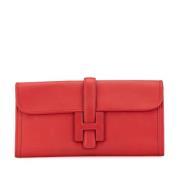 Pre-owned Leather clutches Hermès Vintage , Red , Dames