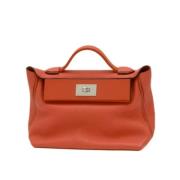 Pre-owned Leather handbags Hermès Vintage , Orange , Dames