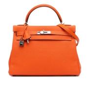 Pre-owned Leather handbags Hermès Vintage , Orange , Dames