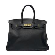 Pre-owned Leather handbags Hermès Vintage , Black , Dames