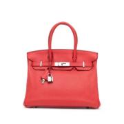 Pre-owned Leather handbags Hermès Vintage , Red , Dames