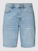 Korte slim fit jeans met contrastnaden