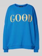 Oversized sweatshirt met statementprint, model 'Good Vibes'