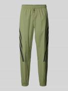 Tapered fit sweatpants met labeltypische strepen