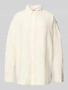 Blouse met extra brede schouders en borstzak