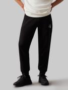 NU 20% KORTING: Calvin Klein Joggingbroek MONOLOGO HWK PANT met een lo...