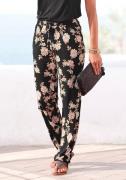 Lascana Strandbroek met all-over bloemenprint en zakken, elastisch, lo...
